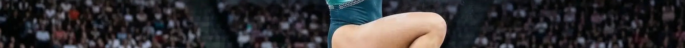 A gymnast wearing a teal and white geometric leotard performs floor routine inspired by alexa moreno and k-pop music