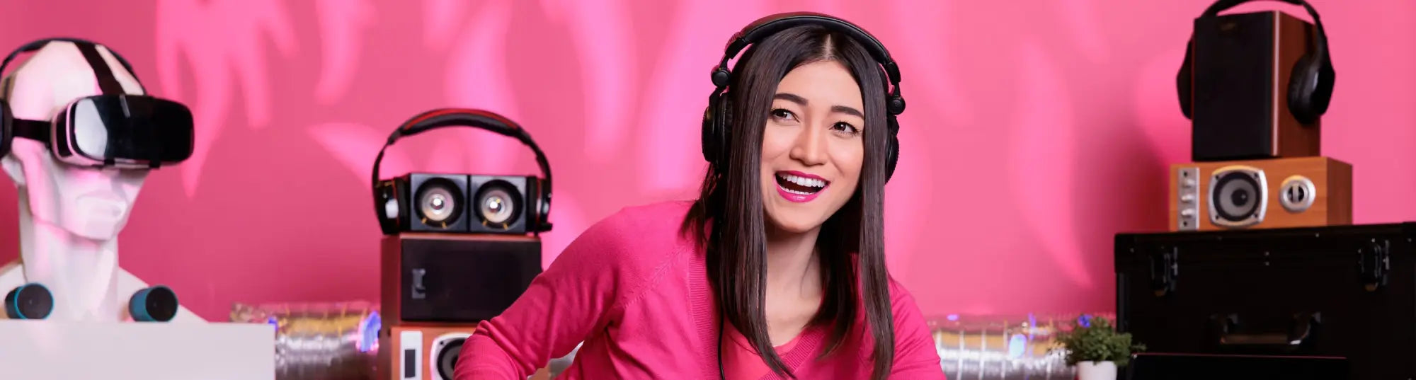 Woman in pink shirt with black headphones for gymnastics floor music
