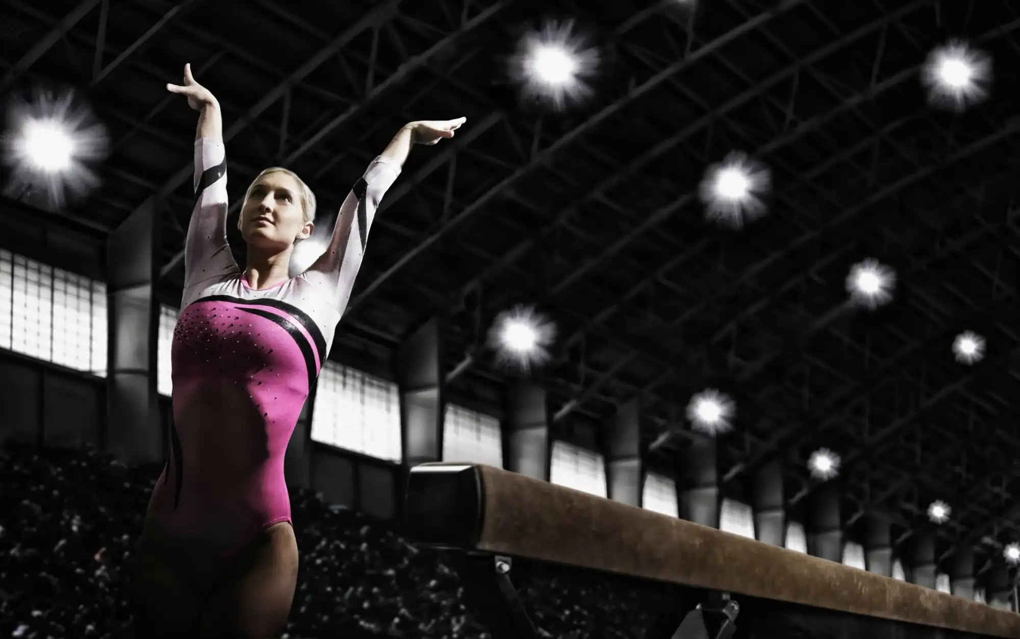 Shiny pink black sequined leotard in gymnastics facts article