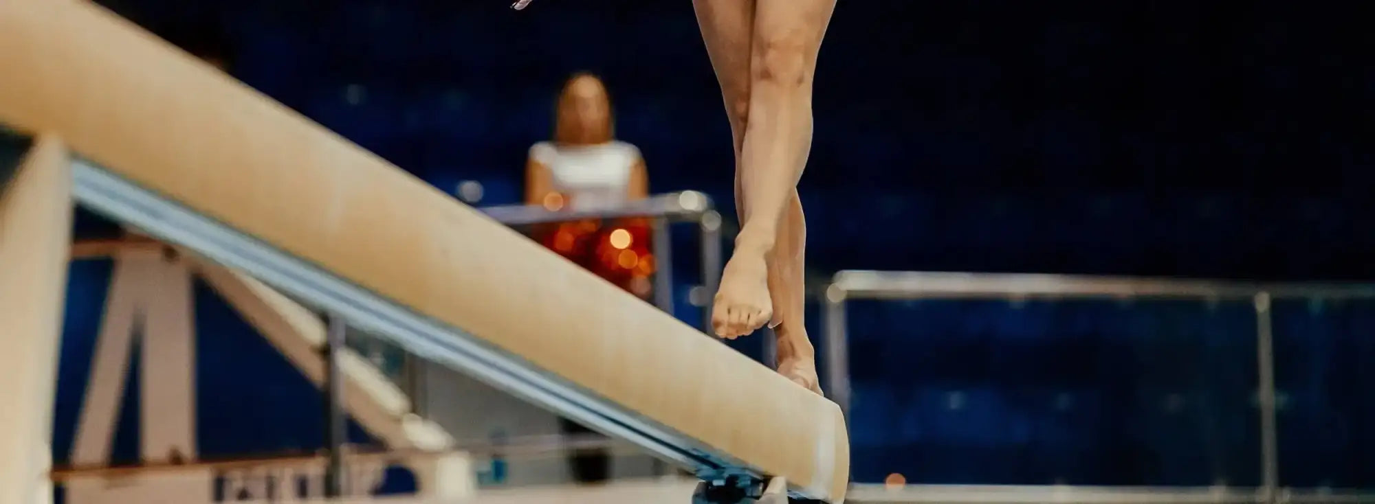 Beige NCAA womens gymnastics balance beam at regionals