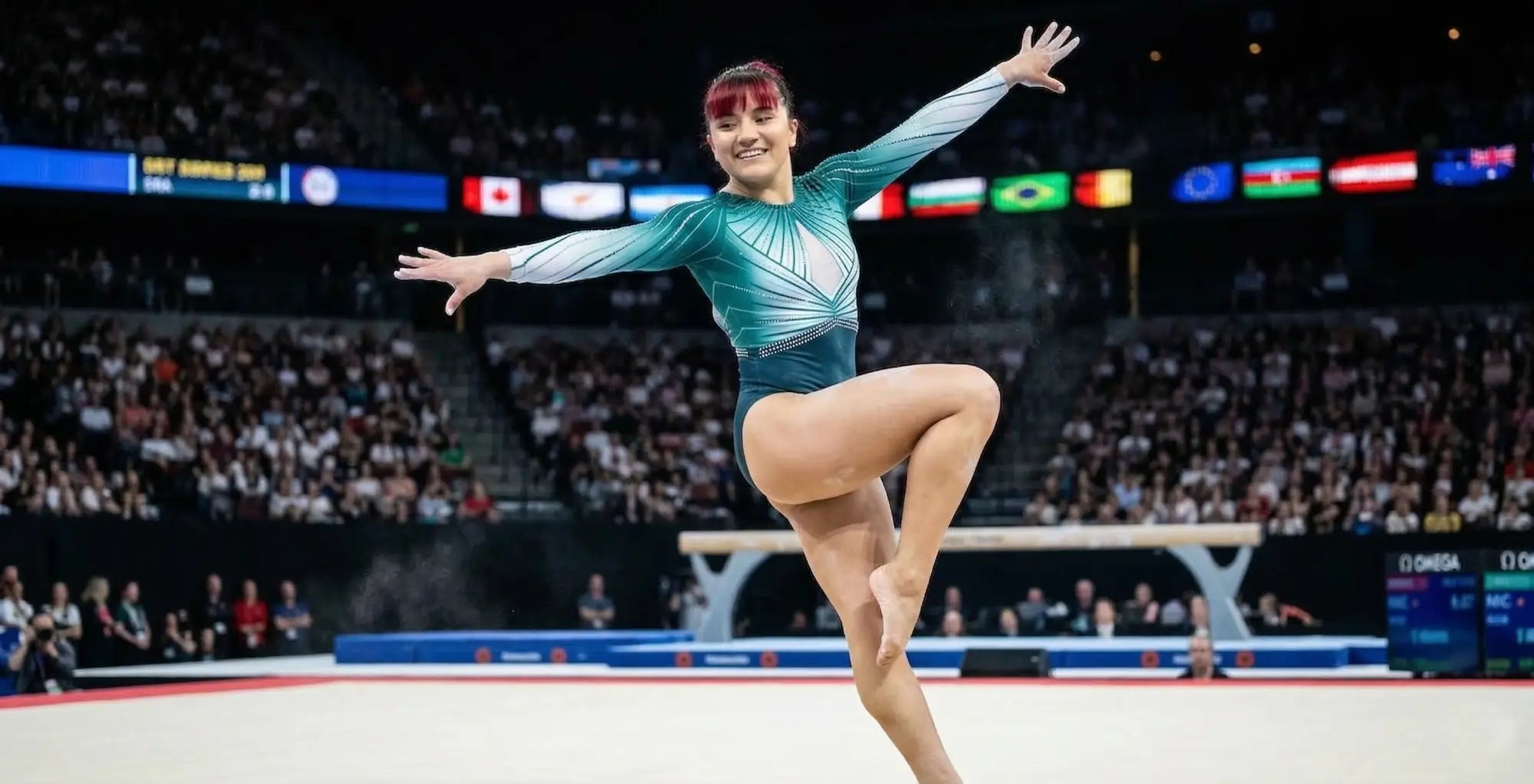 A gymnast wearing a teal and white geometric leotard performs floor routine inspired by alexa moreno and k-pop music