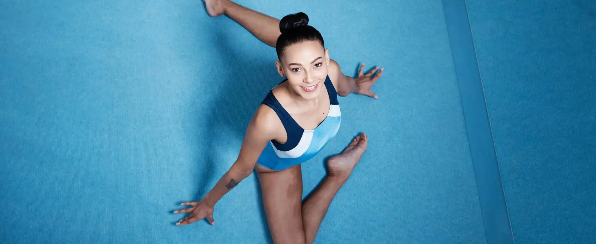 Blue white fitted leotard for NCAA gymnastics conference champs