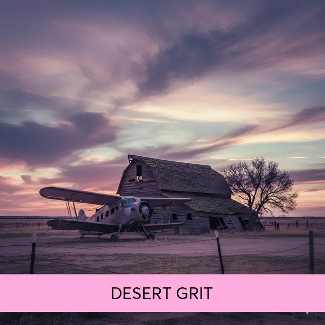 Vintage silver biplane in front of weathered barn at twilight sets the tone for desert grit gymnastics floor music