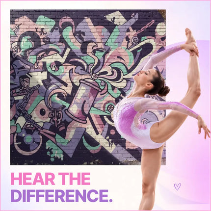 A gymnast in a sparkling white and pink leotard performs a split on a hip-hop gymnastics floor beside vibrant graffiti music art