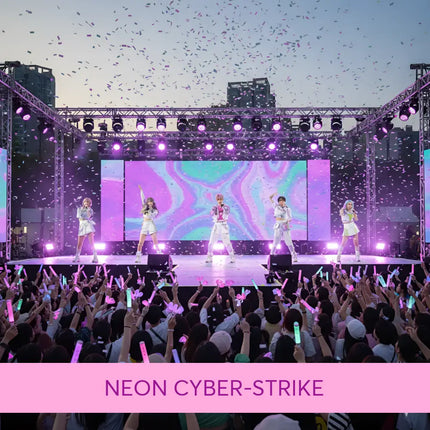 Five performers in white dance on a purple-lit stage with confetti to neon cyber strike gymnastics floor music