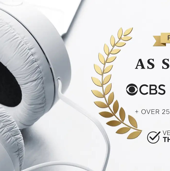 White over-ear headphones with soft, padded earcups and a sleek, minimalist design.